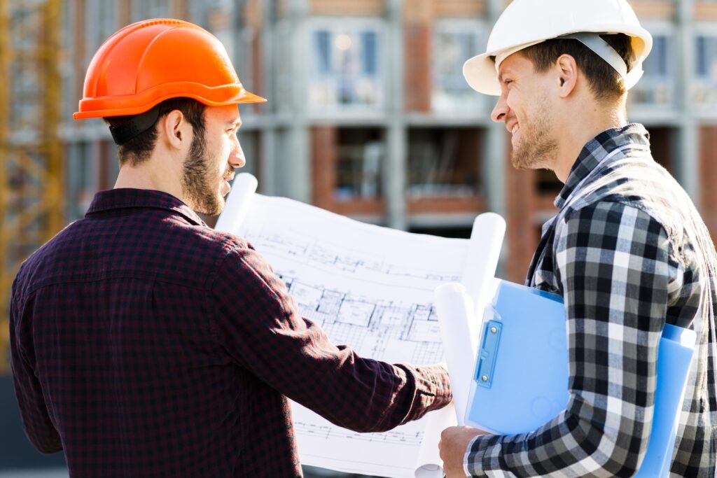 close-up-back-view-engineer-architect-supervising-construction-min