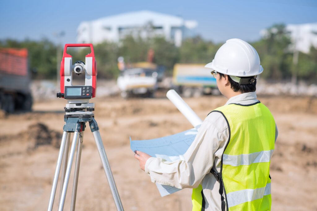 construction-engineer-checking-construction-drawing-site-area-min